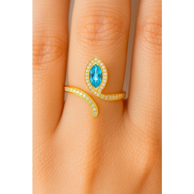 Blue topaz open ended ring in 14k gold. Marquise topaz adjustable ring. Topaz cocktail ring. Snake topaz ring. Metal: 14k...