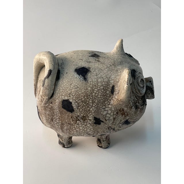 A wonderful creation of this pig beautifully sculptured and glazed and crackled in wonderful hues of white to grey's to...