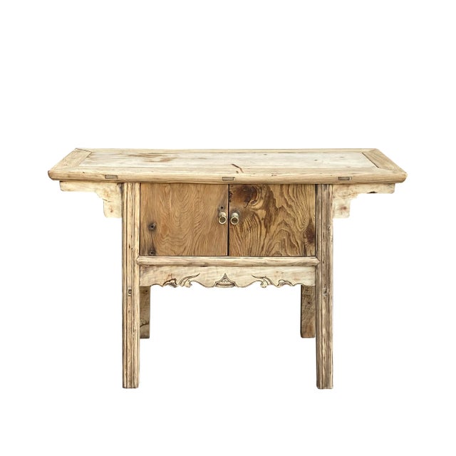 This is a vintage Chinese side altar console table with a simple storage section covered by two doors. It has a simple...