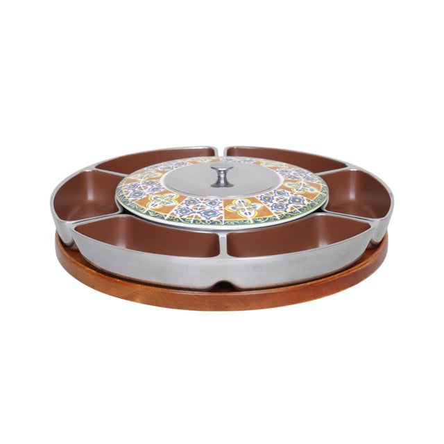 A mid-century modern lazy Susan serving tray by Lenox. A circular wooden plate supports four metal trays with brown enamel...