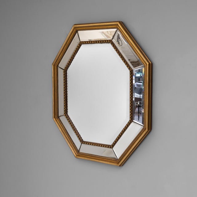 French octagonal cushion mirror with original mirror and later finish. Circa 1870.