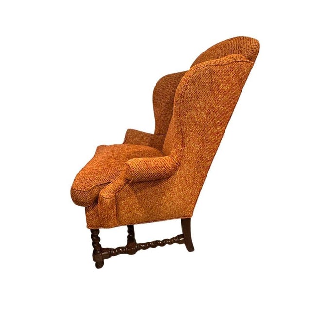 Vintage wingback chair blending classic Queen Anne elegance with iconic Archie Bunker–style comfort. Featuring a high,...