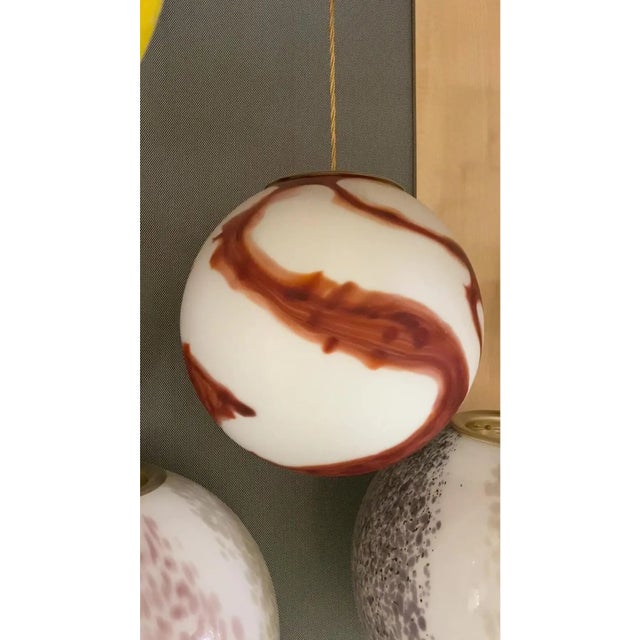 Impressive scenographic milky-white and brown Sphere in Murano Glass Design in very particular and effective movement. in...