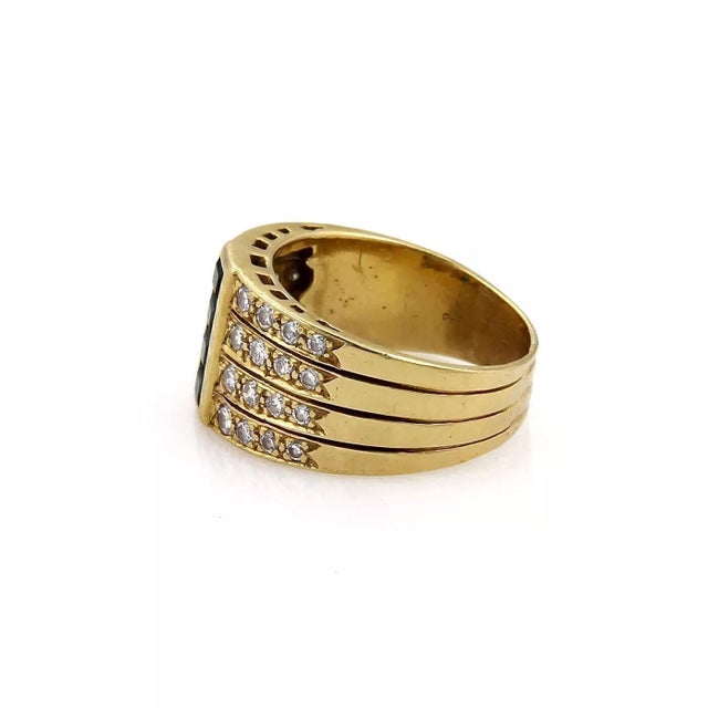 This is a lovely vintage wide tapered band ring, it is crafted from 18k yellow gold with a tapered form, the front of the...
