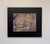 This mixed media artwork presents an abstract landscape, where layers of earthy tones intertwine with hints of vibrant...
