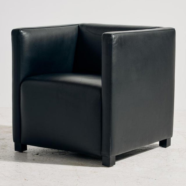 The ‘Cubic’ armchair designed by Paolo Piva for Wittmann in the 1980s. The furniture has interesting shapes, wooden legs...