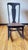 Vintage armless wooden rocking chair with woven cane seat, likely dating to the late 19th or early 20th century. The chair...