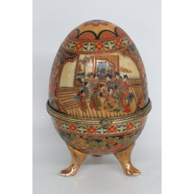 This beautiful Footed Egg Box is made of porcelain. This decorative egg has a lovely Japanese inspired style; it features...