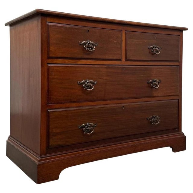 A handsome and well-proportioned 20th-century mahogany chest of drawers, combining generous practical storage, quality...