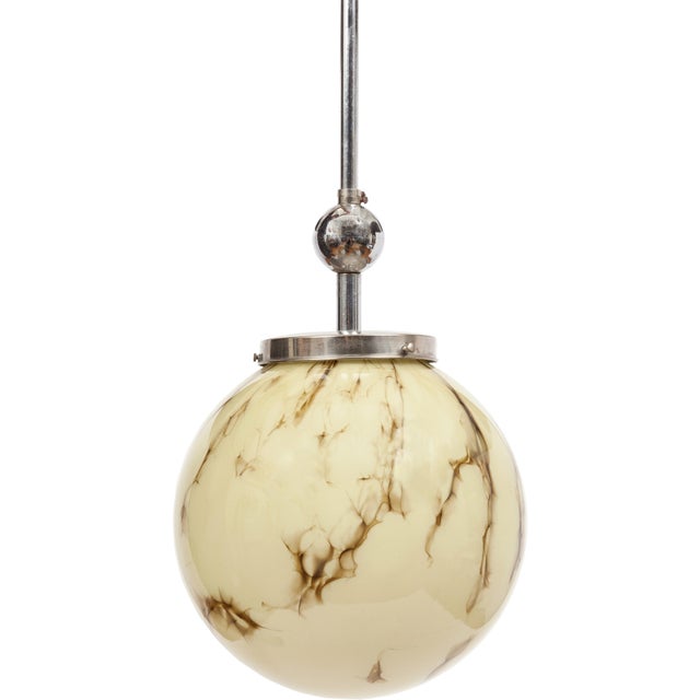 Stunning vintage Italian pendant light from the 1960s with hand-blown marbled glass globe and chrome hardware. Wired to US...