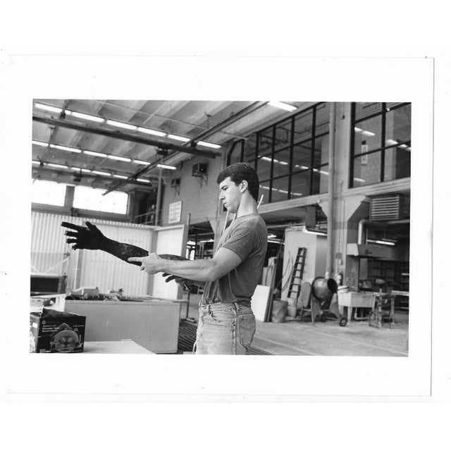 1989 b & w photograph of artist Charles Kiss and part of a sculpture he was completing