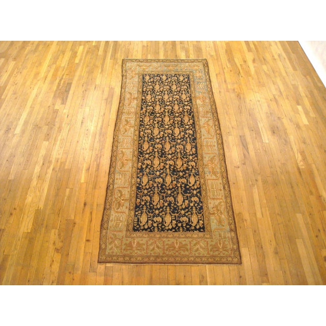 An antique Persian Malayer oriental rug in a small runner size, size 8'3" x 3'7", circa 1910. This unique hand-woven...