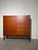 Beautiful vintage mid-century highboard featuring a warm teak veneer with elegant horizontal grain. This piece combines...