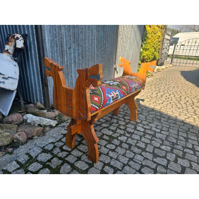 Wooden bench, stool, folk style, with carved dogs on the sides, 1960s, dimensions: height 57 cm, width 81.5 cm, depth 35...