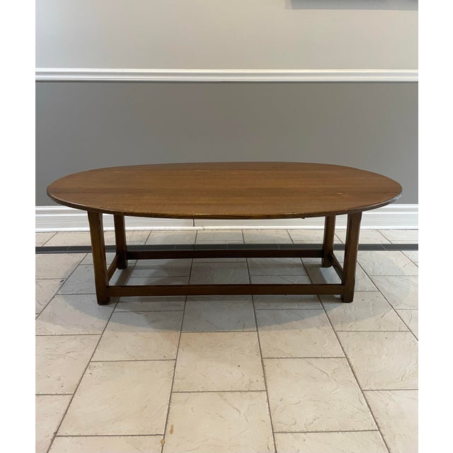 A versatile 1940s drop-leaf Colonial Revival coffee table with the kind of practical, multipurpose design people loved in...