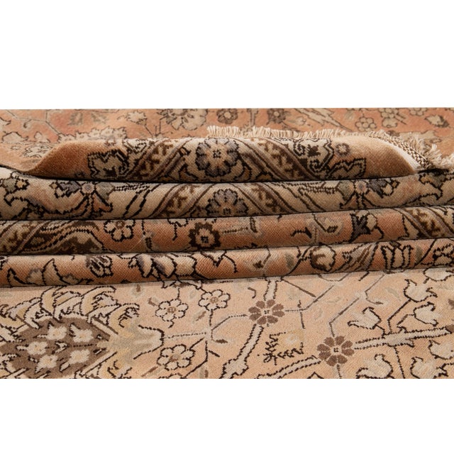 Early 20th-century antique Tabriz wool rug with a floral motif. This piece features vibrant colors and an exquisite...