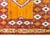 A bold vintage mid-20th century Moroccan rug with a large central diamond medallion set against an orange rectangular...