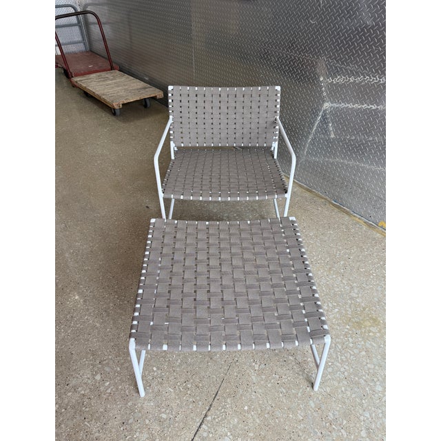 The Stretch Lounge Chair by Richard Frinier reveals a modern take on vintage Brown Jordan strap designs evolving and...