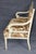 A wonderfully decorative and generously proportioned Louis XVI-style settee, distinguished by its heavily stylized carved...