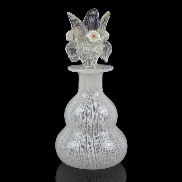 Beautiful vintage Murano hand blown white Zanfirico ribbons Italian art glass decorative vanity bottle. The piece is...