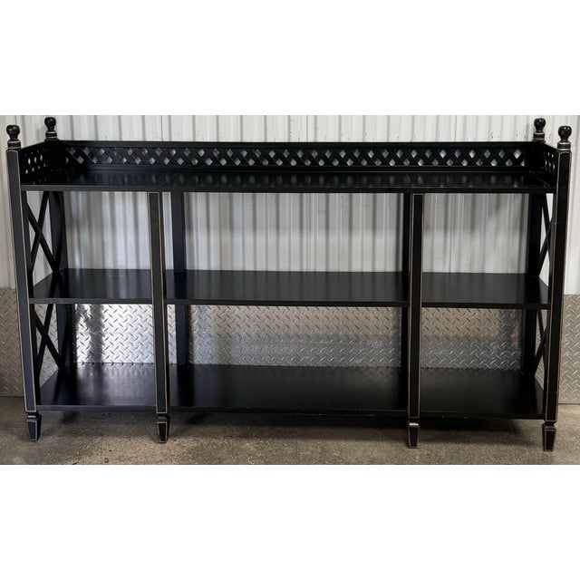Beautiful regency style console table by Ardley Hall. Features three tier construction, lattice galley, cross supports on...