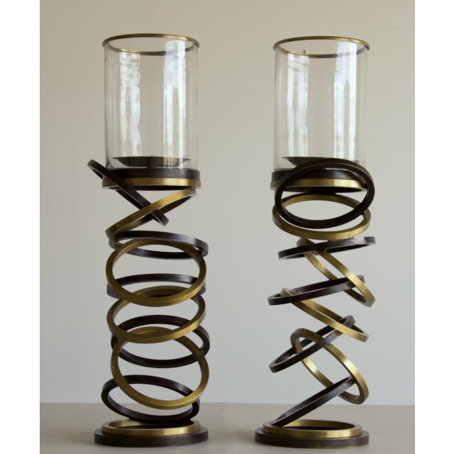 A substantial (24lbs each) pair of sculptural hurricanes by Maitland-Smith. The columns give a striking impression of...