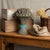 Celebrate the harvest season year-round with this vintage cast iron wheat sheaf doorstop featuring a rich antiqued gold...