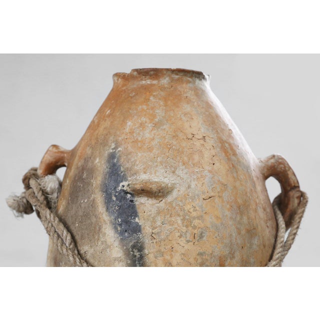 A beautifully authentic example of mid‑19th‑century French provincial pottery, this terracotta vase embodies the rustic...