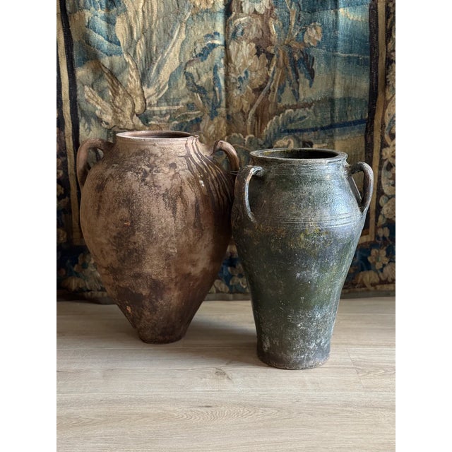 This antique Turkish olive jar stands out for its rare deep green glaze and uncommon three-handled form. Traditionally...