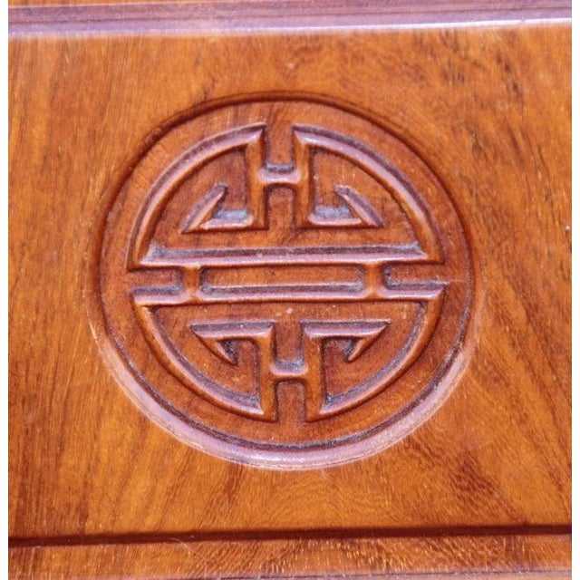 Pair Chinosarie Nightstands 1990s Pair of beautifully carved bedside cabinets from Asia. Rosewood with bronze pulls. One...