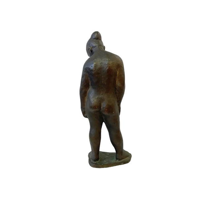 This mold casted solid bronze sculpture of a standing female shows a lot of handmade quality. Maker unknown.