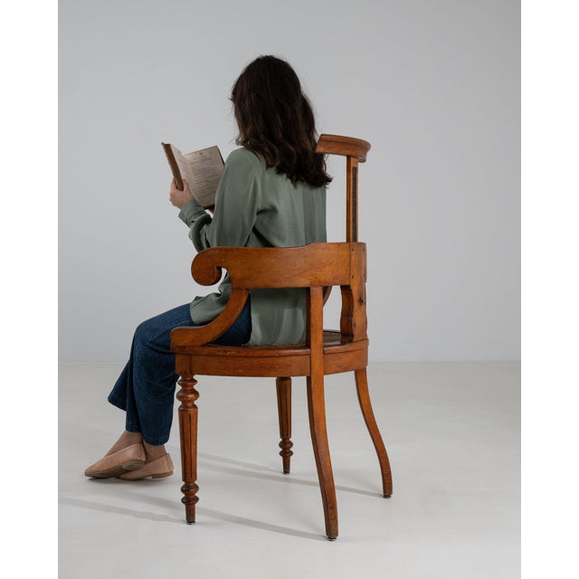A armchair whose dark mahogany wood, cane/wood seat, turned legs gives it real character at first glance. Originating in...