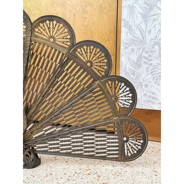 An exquisite Belle Époque fireplace screen rendered as a peacock in full display—a sculptural conversation piece that...