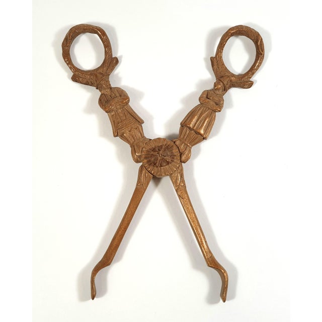 A very unique pair of tongs, for sugar or grape Made from finely carved light wood, very elaborated and exquisite Both...