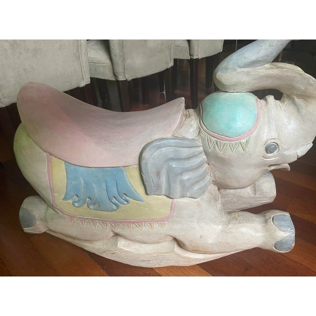 Late 20 th century carved rocking elephant and hand painted. Made of one piece of wood. Very heavy and can be ridden. Very...