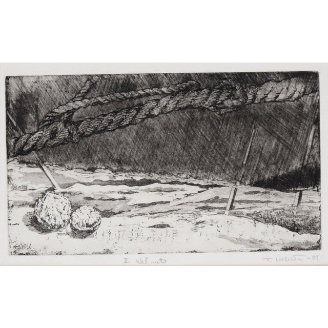 Abstracted dry point etching by Tomoya Uchida (Japanese, 20th Century). Two walnuts sit in an abstracted space, with ropes...
