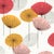 Sanderson Dandelion Clocks Wallpaper in Coral - a Sample For Sale
