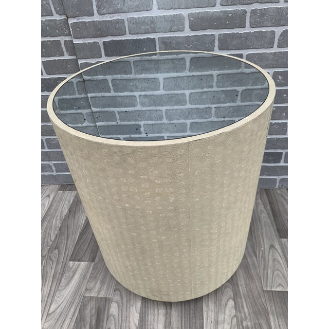 Made Goods Jordan Faux Tortoise Drum Side Table in Cream Faux Turtle with Antiqued Mirror Inset Top A spin on our iconic...