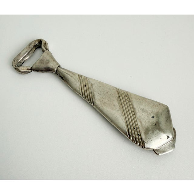 A dapper and tongue-in-cheek bar accessory great for gifting! Vintage 1960s made in Italy silver plate bottle cap open in...