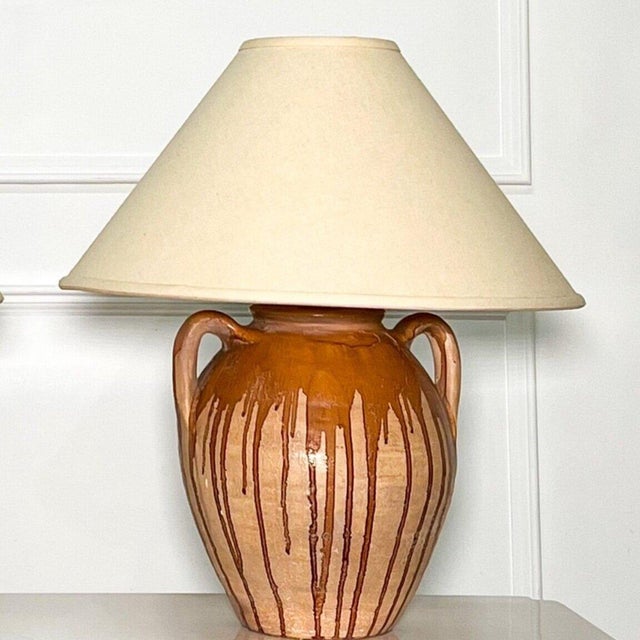 Circa 1970’s drip glazed pottery lamp with handles. Original shade. Pottery lamp base in wonderful vintage condition....