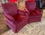 Pair of Dark plum/burgundy club chairs. Comes with armrest cover. Labeled "Steel workers of America" with additional...