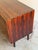 Beautiful vintage Danish Mid Century Modern sideboard crafted in richly grained rosewood, featuring striking bookmatched...