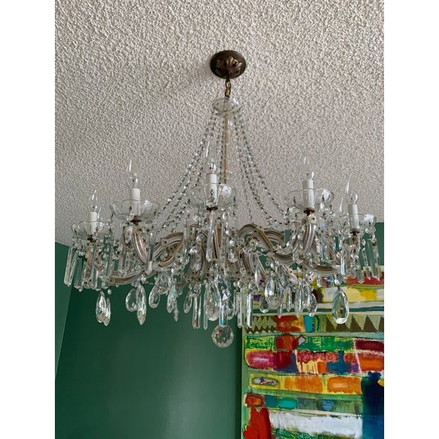 Beautiful crystal chandelier bought in France in 1960 3 feet across by 40" tall. It was my parents and believe it is old....