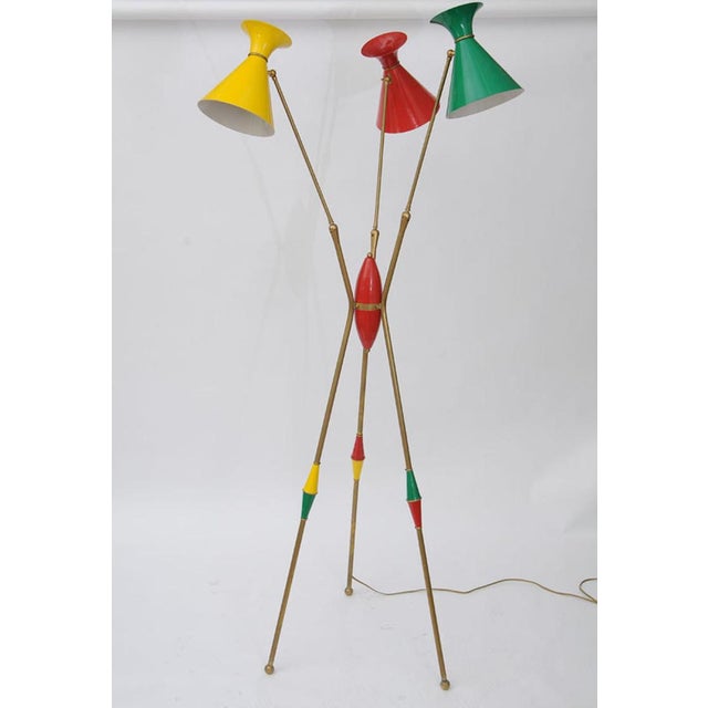 Very rare floor lamp from Stilnovo, Italy. Three enameled shades in primary colors. Adjustable arms and shades. Featuring...
