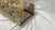 This is an art glass wall lamp with a sophisticated and scenic design. The gold-painted iron frame is entirely covered...