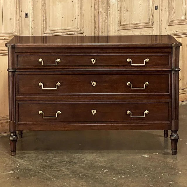 19th Century French Directoire Mahogany Commode exudes the understated elegance for which the style is world renowned!...