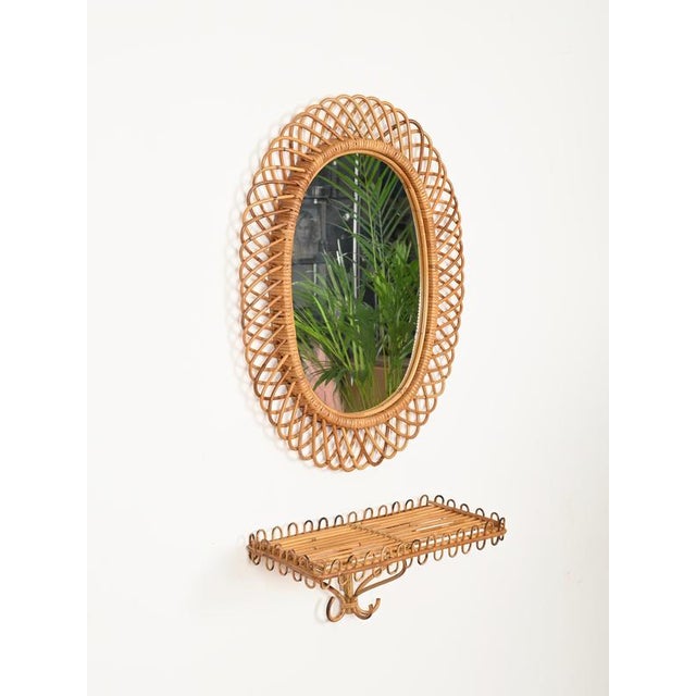 Stunning mid-century organic rectangular wall shelf in curved rattan, bamboo, and hand-woven wicker. This charming French...