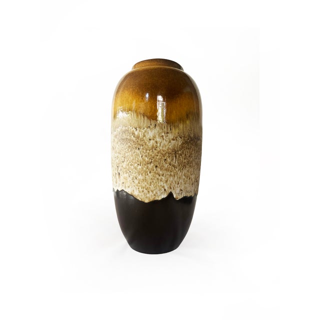 A commanding piece of west german studio pottery in an exceptional scale. This xxl floor vase is finished in a rich fat...