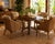 A sophisticated set of four vintage lounge dining armchairs by McGuire of San Francisco, blending the brand’s iconic...