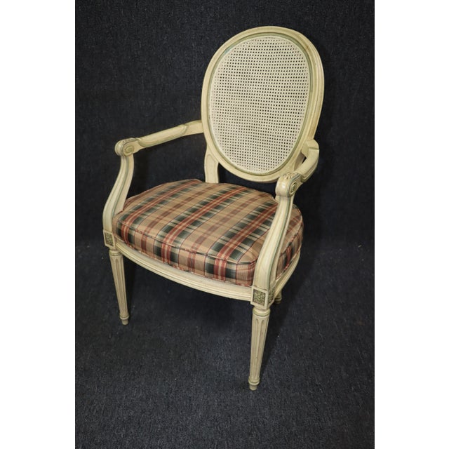 Vintage Louis XVI style round cane back occasional chair in cream with gilded and sage accents. Newer upholstery.